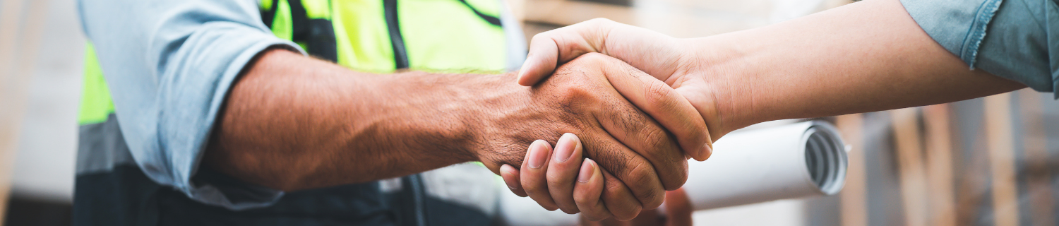 Ideal Roofing and Construction a handshake is a promise, a contractor and client shake hands